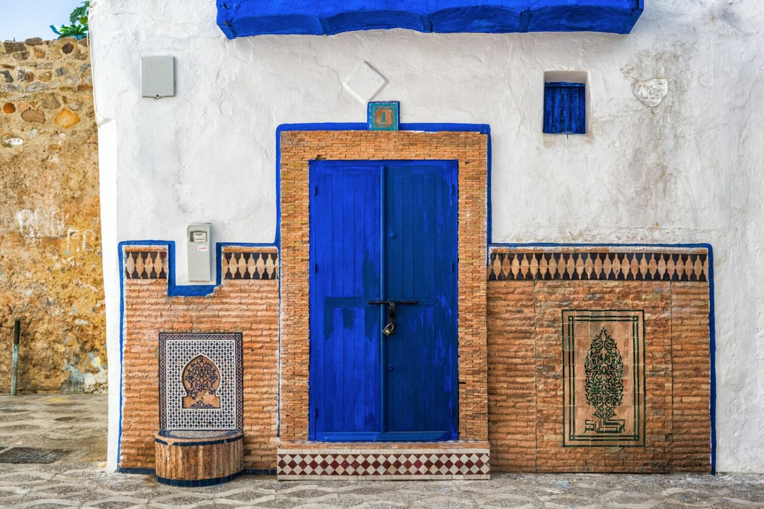 a blue and white building with a blue door